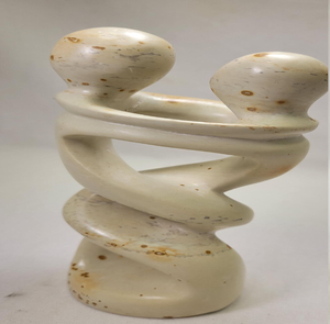 Intertwined beige soapstone lovers sculpture showing abstract curved form, available at wholesale prices. - Product Image 1