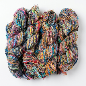 Hilos de lino reciclados multicolor con tonos vibrantes y textura natural, ideales para tejer, coser, hacer crochet y bordar. - Product Image 1