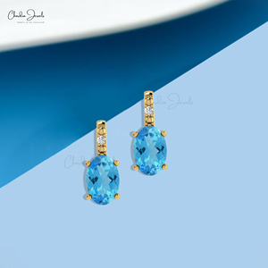 Pendientes de tuerca ovalados de topacio azul suizo de 6x4 mm con detalles de diamantes y cierre a presión de oro macizo de 14k, joyería al por mayor para bodas - Product Image 6