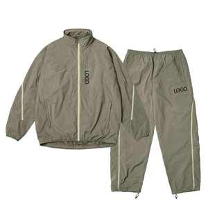 Pantalon de survêtement ample pour homme, léger, coupe-vent, en nylon, avec fermeture éclair réglable aux chevilles - Product Image 1