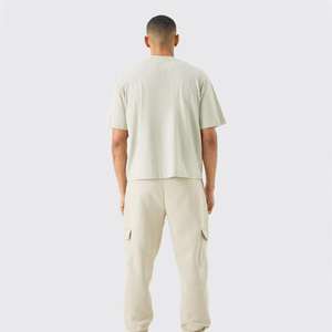 เสื้อยืดครอปแขนสั้นทรงหลวมสำหรับผู้ชาย ผ้าฝ้าย 100% ผลิตตามสั่ง พร้อมปักโลโก้ ผ้าแคนวาสคุณภาพสูง บริการ OEM - Product Image 2