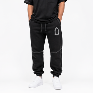Pantalon de jogging baggy noir pour homme style streetwear hip-hop avec empiècements contrastants blancs et cordon de serrage - Product Image 1