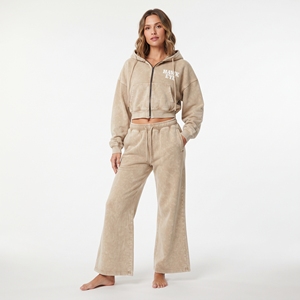 Conjunto de sudadera con capucha de algodón beige para mujer, con cremallera completa, hombros caídos y mangas largas, y pantalones jogger de pierna ancha con lavado ácido. - Product Image 1