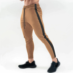 กางเกงวอร์มวิ่งผู้ชาย ทรงจ็อกเกอร์ เอวผูกเชือก ผ้าไนลอนผสมสแปนเด็กซ์ กางเกงออกกำลังกาย ฟิตเนส เล่นกีฬา ฝึกซ้อมลำลอง ทรงสกินนี่ - Product Image 1