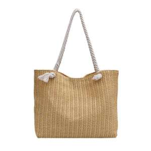Dale un toque moderno a tus atuendos con este vibrante bolso de hilo natural con un cuerpo texturizado y correas de cuerda resistentes. - Product Image 1