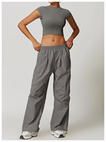 Ensemble de yoga pour femmes, haut court à col rond et dos nageur, pantalon taille haute, couleur unie, en spandex et polyester, ensemble 2 pièces respirant avec poches