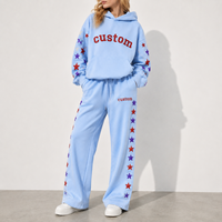 Ensemble de survêtement streetwear vintage surdimensionné personnalisé pour femme avec sweat à capuche et pantalon large à motifs étoiles scintillantes et logo personnalisé