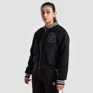 Veste universitaire noire pour femme avec bordure blanche, fermeture éclair, logo sur le devant, coupe classique, manches longues, polyester tissé, idéale pour l'automne - Product Image 2