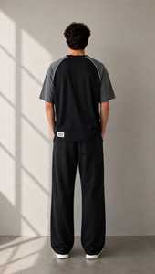 Conjunto de camiseta de manga corta con bloques de color y pantalones con cordón para hombre, corte holgado, transpirable, informal, de algodón. - Product Image 2