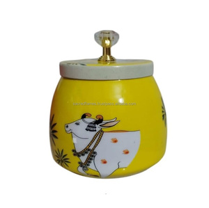 Tarro de almacenamiento decorativo con tapa y pomo, con estampado de vaca Pichwai indio en esmalte, al por mayor - Product Image 1