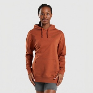 Sudadera con capucha color naranja óxido para mujer, con hombros caídos y bolsillo canguro - Product Image 1