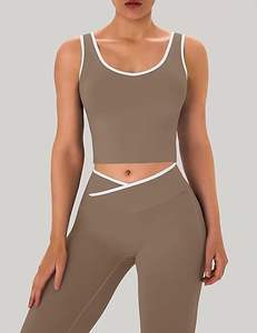 ชุดออกกำลังกายผู้หญิง 2 ชิ้น ชุดโยคะ กางเกงเลกกิ้งขาบานแบบไขว้ เสื้อครอปท็อปแต่งขอบตัดสี - Product Image 1