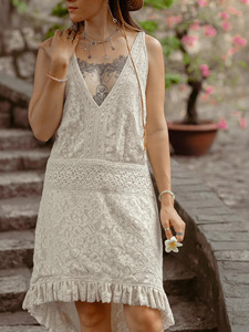 Robe asymétrique bohème chic en coton ivoire brodée à la main style Chikankari, avec ourlet à volants, décolleté en V profond et dentelle crochetée complexe - Product Image 5