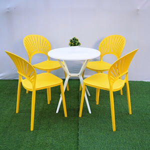 Chaise en plastique moulé jaune moderne, écologique et imperméable avec dossier ventilé pour fêtes de jardin sur surfaces moelleuses - Product Image 1