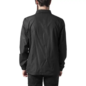 Veste Coach en nylon noir de qualité supérieure pour homme, fermeture à boutons pression, style minimaliste décontracté, streetwear urbain. - Product Image 2