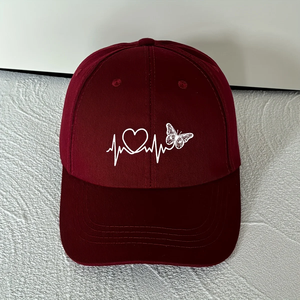 Una gorra de béisbol minimalista con diseño de estampado de latido de mariposa en blanco para protección solar y protección contra el sol en deportes al aire libre. - Product Image 1