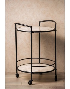 Carrito de bar circular de metal blanco con base de mármol en la parte superior e inferior, varillas de metal negro y 4 ruedas en la parte inferior. - Product Image 1