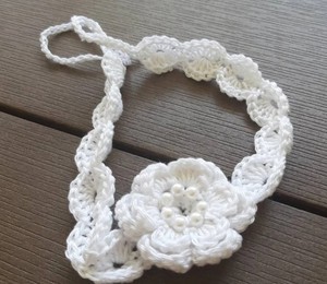 White crochet baby <b>headband</b> with white pearl <b>beaded</b> flower - Product Image 3