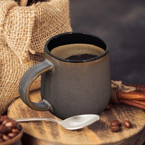 Taza de Café de Cerámica Premium con Acabado Mate Moteado, Interior Negro Intenso, Agarre Ergonómico y Estructura de Retención de Calor para un Disfrute Elegante - Product Image 1
