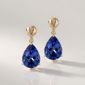 Boucles d'oreilles pendantes tendance en or 18 carats et platine avec tanzanite en forme de poire et diamants, bijoux élégants pour femmes, fabricant OEM - Product Image 3