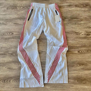 กางเกงวอร์มแฟชั่นใหม่ทรงหลวมสำหรับทุกเพศ ผ้าไนลอนกันน้ำ สไตล์ลำลอง ลายทางโค้ง ระบายอากาศได้ดี ไซส์พลัสสำหรับผู้ชาย - Product Image 1