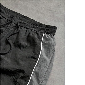 กางเกงกันลมไนลอนสำหรับผู้ชายกางเกงวิ่งออกกำลังกายแบบผูกเชือกเอวยางยืดกางเกงลำลองป้องกันรอยยับออกแบบโลโก้ได้ตามต้องการ - Product Image 6