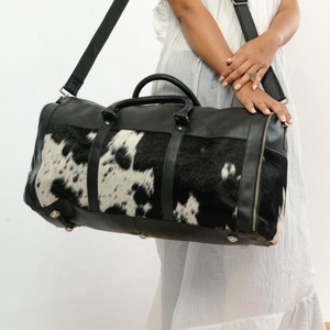 กระเป๋าเดินทางหนังวัววินเทจสำหรับผู้ชายและผู้หญิง - Product Image 1