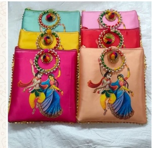 Pochettes ethniques artisanales avec impressions numériques de Krishna et Radha dans une danse joyeuse, accents pompons, pochettes en satin de soie - Product Image 1