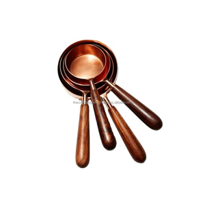 Juego de 4 Tazas Medidoras de Acero Inoxidable con Acabado PVD Cobre y Asas de Madera, Fácil Agarre, Aptas para Lavavajillas - Product Image 1