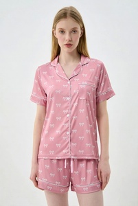 Womens blue star print pajama set with short sleeve button up top and drawstring pants in studio for cute comfortable sleepwear - Product Image 2