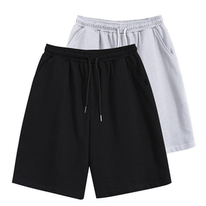 กางเกงขาสั้นผู้ชายผ้าฝ้ายสีพื้นพร้อมเชือกผูกเอวและกระเป๋าข้างสไตล์ลำลองผ้าถักเอวกลาง - Product Image 1