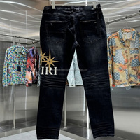 Jean slim homme taille mi-haute de haute qualité, déchiré, en denim bleu délavé avec autocollants, pour le printemps et l'automne - Stock