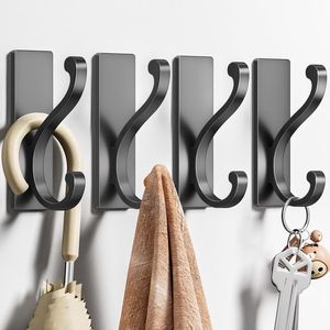 Set di 4 Ganci da Parete Autoadesivi Neri Resistenti per Appendere Vestiti, Asciugamani, Chiavi in Cucina e Bagno - Product Image 1