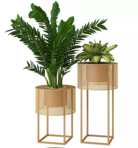 Set of 2 <b>white</b> ribbed cylindrical metal planters with black stands, sleek planter <b>pots</b>, available at wholesale prices. - Product Image 1