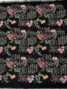 Tissu en velours brodé motif floral botanique, base noire, fil rose moutarde, pour la confection de manteaux, kaftans et autres projets de couture - Product Image 1