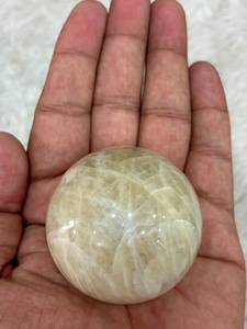 Cream moonstone <b>sphere</b> with soft ivory coloring subtle sheen rounded contours smooth polishing and refined mineral appeal - Product Image 4