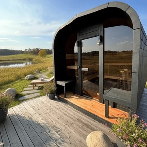 Sauna moderne <span class=keywords><strong>en</strong></span> forme de pod avec véranda intégrée, extérieur gris foncé résistant aux intempéries et chauffage au <span class=keywords><strong>bois</strong></span> pour une relaxation <span class=keywords><strong>en</strong></span> plein air toute l'année - Product Image 5