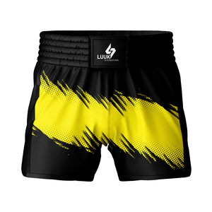 Shorts de boxe personnalisés pour hommes, design jaune et noir imprimé, polyester à séchage rapide, vêtements d'arts martiaux, coupe régulière, shorts MMA Muay Thai - Product Image 1