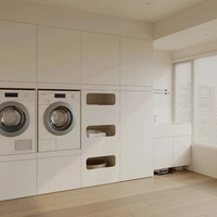 Armoire de buanderie moderne blanche Senger avec niches intégrées pour lave-linge et sèche-linge et étagère à panier à linge extractible