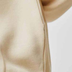 เสื้อฮู้ดผู้ชายสีครีมทรงโอเวอร์ไซส์ สีพื้น เรียบง่าย สวมใส่สบาย ผลิตจากผ้าฝ้าย 100% แบบถักเฟรนช์เทอร์รี่ - Product Image 4