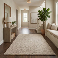 Tapis demi-cercle moderne en laine naturelle tissé à la main, crème texturé, avec envers antidérapant en caoutchouc, pour salon