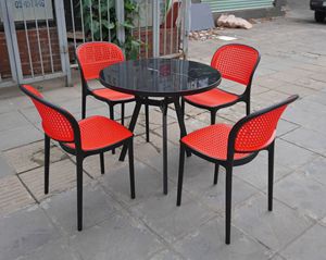 Modern Red <b>Plastic</b> Outdoor Dining Chair <b>Set</b> with Rounded Back and Black Glass Table 1 Year Warranty for <b>Patio</b> Use - Product Image 1