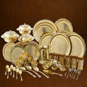 Intricately <b>carved</b> golden Kansa bronze thali <b>set</b> includes multiple katoris <b>and</b> cutlery, available at wholesale prices. - Product Image 3