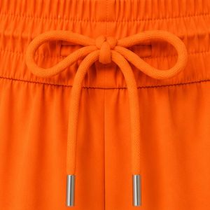 Shorts de course pour femmes orange avec passepoil bleu roi, en polyester, séchage rapide, taille élastique avec cordon de serrage, pour athlétisme, gym et fitness, OEM - Product Image 6