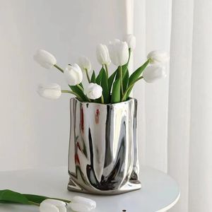 <b>Unique</b> metal flower <b>vase</b> expressing creative excellence ideal for enhancing rooms with fashionable metallic accent - Product Image 6