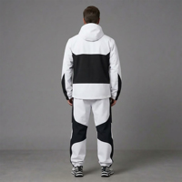 Ensemble survêtement homme sur mesure color block, veste coupe-vent zippée et pantalon, style rétro streetwear et sportswear