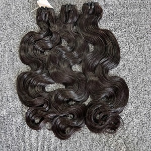 Venta al por mayor de extensiones de cabello ondulado vietnamita cuerpo sin trama de máquina de procesamiento químico - Product Image 2