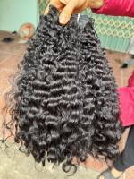 Prix d'usine en gros Cheveux humains vierges Remy noirs naturels vietnamiens faits à la main bouclés ondulés doux et lisses tissage à double trame à la machine