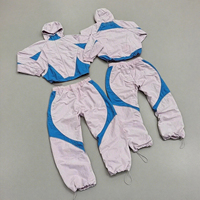 Ensemble de survêtement d'hiver en gros, coupe-vent à capuche, personnalisé, léger, deux pièces, veste et pantalon en polyester/coton