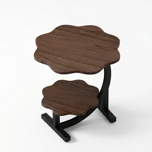 Table basse vintage avec deux plateaux en bois sculpté, structure en métal noir courbé et design décoratif raffiné - Product Image 2